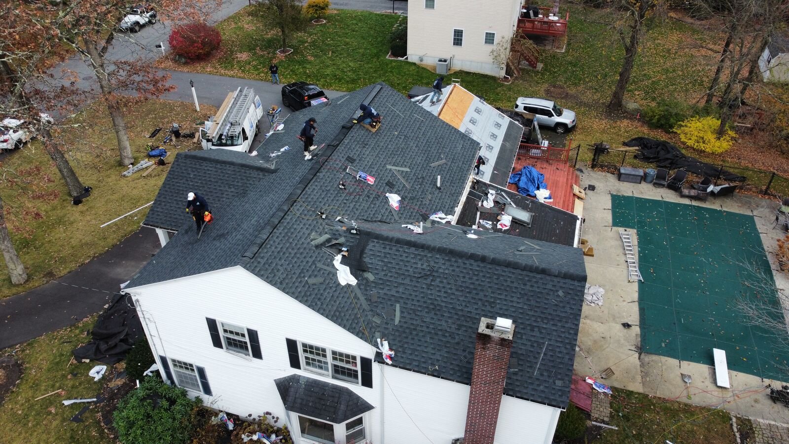 Aerial view of a new charcoal architectural shingle roof on a colonial in Milford, MA